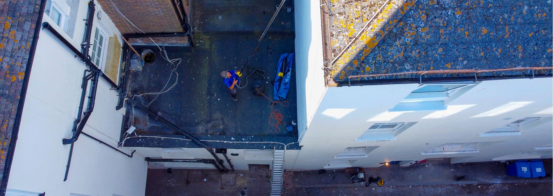 Gutter clearance work on properties in central Brighton.