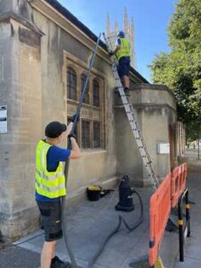 Gutter clearance and maintenance work on a church.